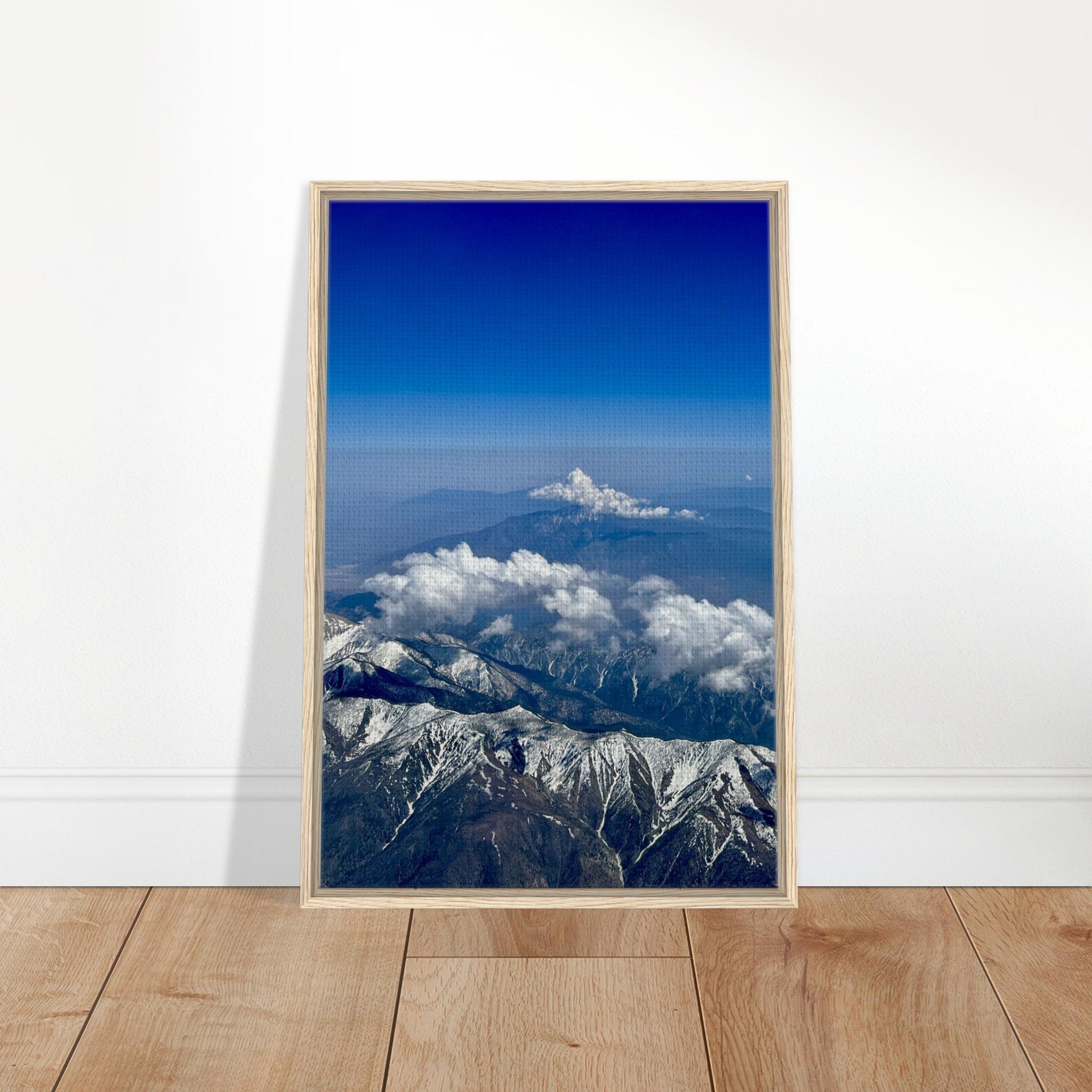 Framed canvas print of the Rocky Mountains with blue skies and snow-covered peaks, from the Travel Collection Studio Edition.