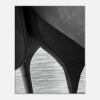 Black and white abstract canvas print of NYC Hudson River Pier with high heels in water, from the Studio Edition Travel Collection.