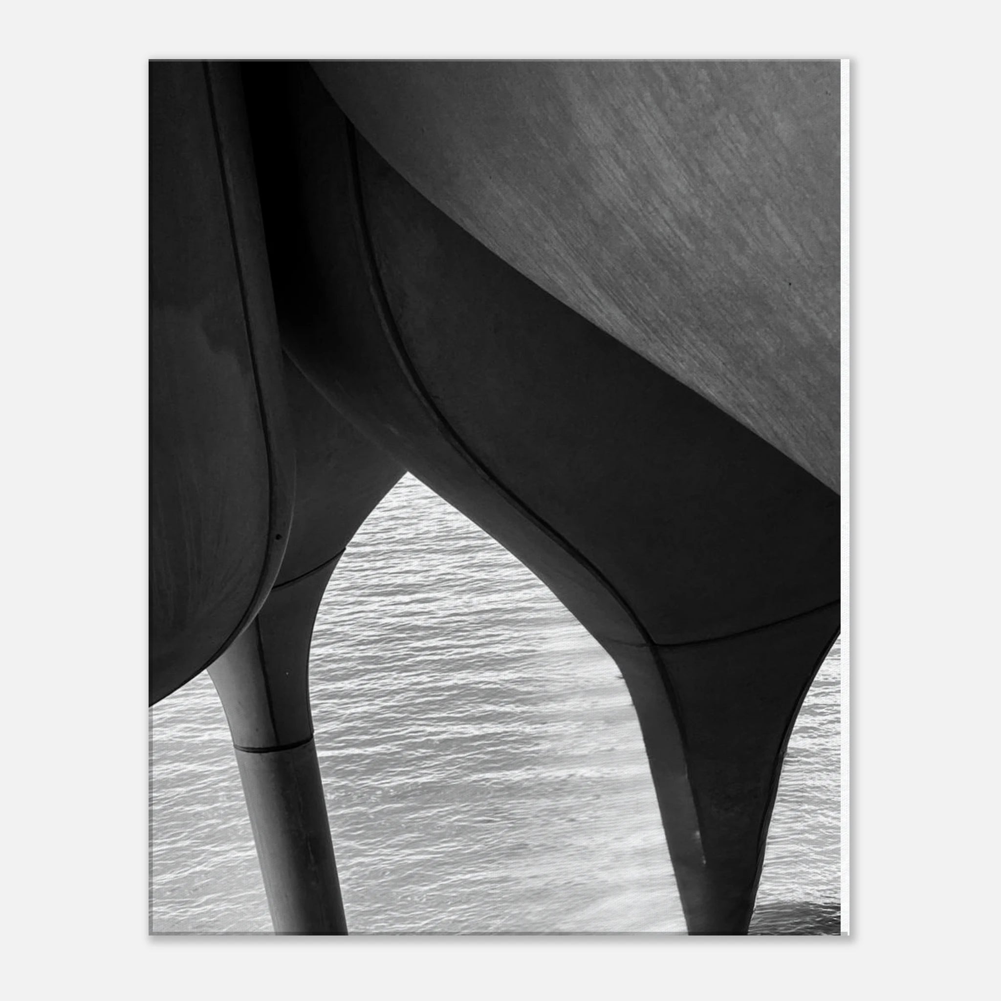 Abstract black and white canvas print of NYC Hudson River pier with high heels in water, part of the Studio Edition Travel Collection.