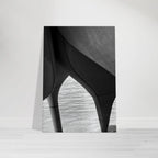 Black and white abstract canvas print of NYC Hudson River pier with high heels in water, part of Studio Edition Travel Collection.