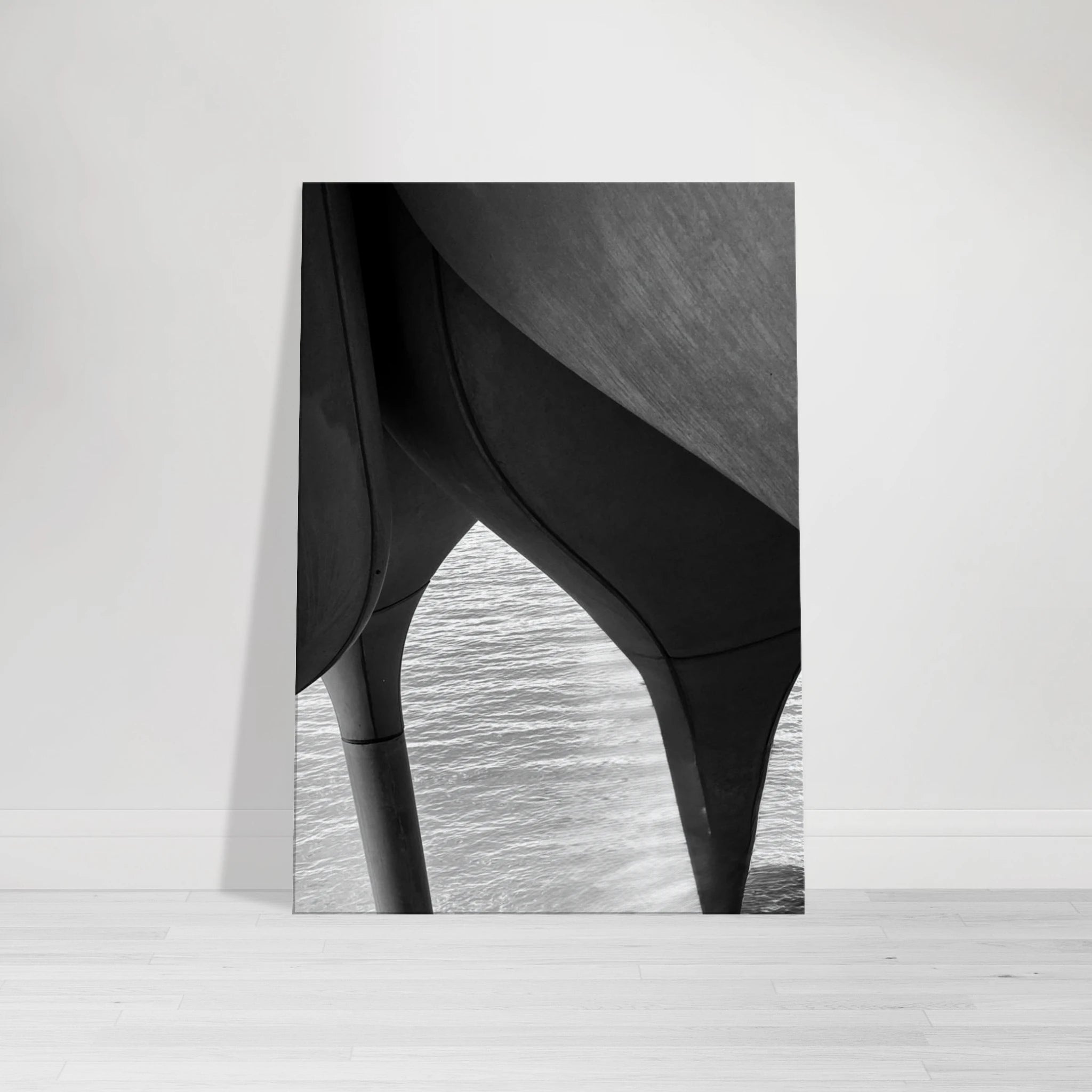 Black and white abstract canvas print of NYC Hudson River pier with high heels in water, part of Studio Edition Travel Collection.