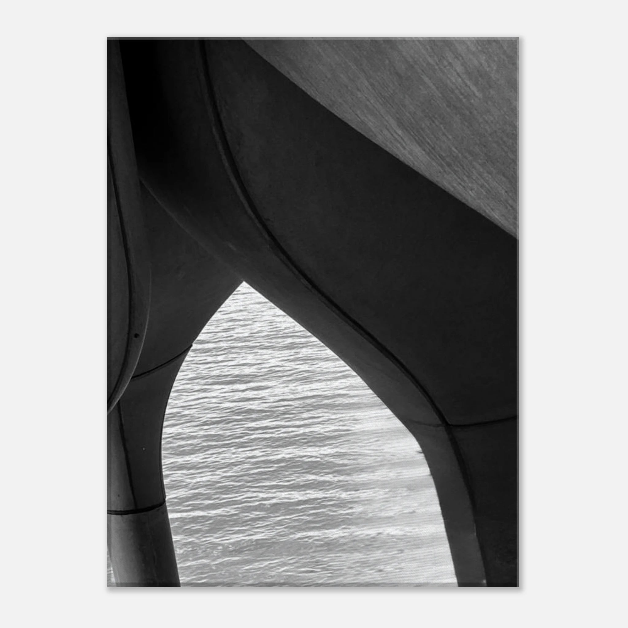 Black and white abstract canvas print of NYC Hudson River pier with high heels in water, part of the Studio Edition Travel Collection.