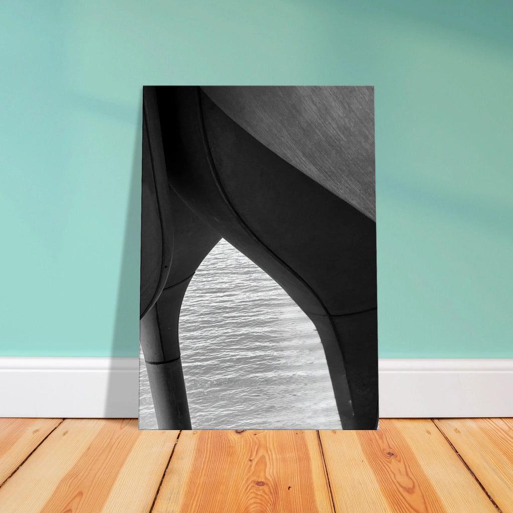 Black and white abstract canvas print of NYC Hudson River pier with high heels in water, from Studio Edition Travel Collection.
