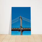 Sunny Winter Day canvas print featuring the Manhattan Bridge in NYC, showcasing vibrant winter cityscape for home decor.