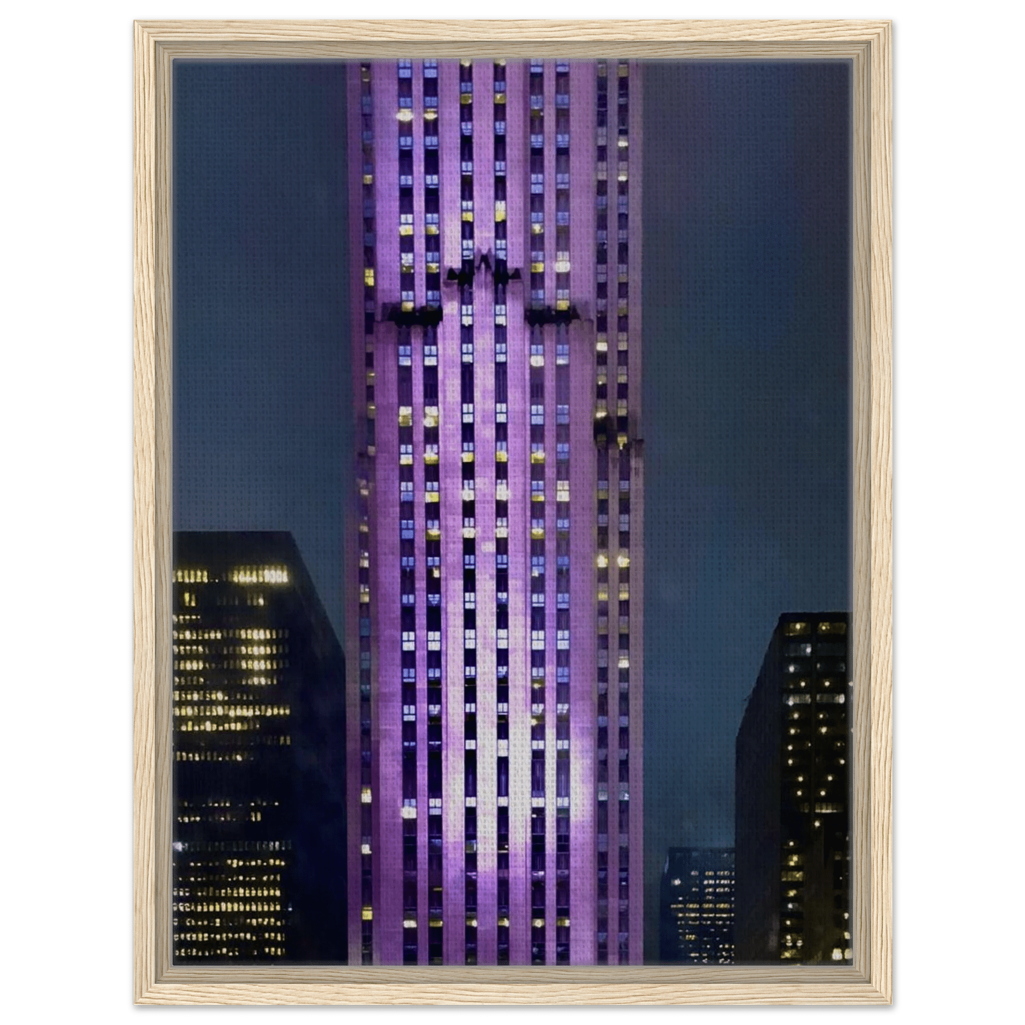 Framed canvas print of NYC holiday skyline in purple hues, part of the Travel Collection Studio Edition, showcasing cityscape at night.