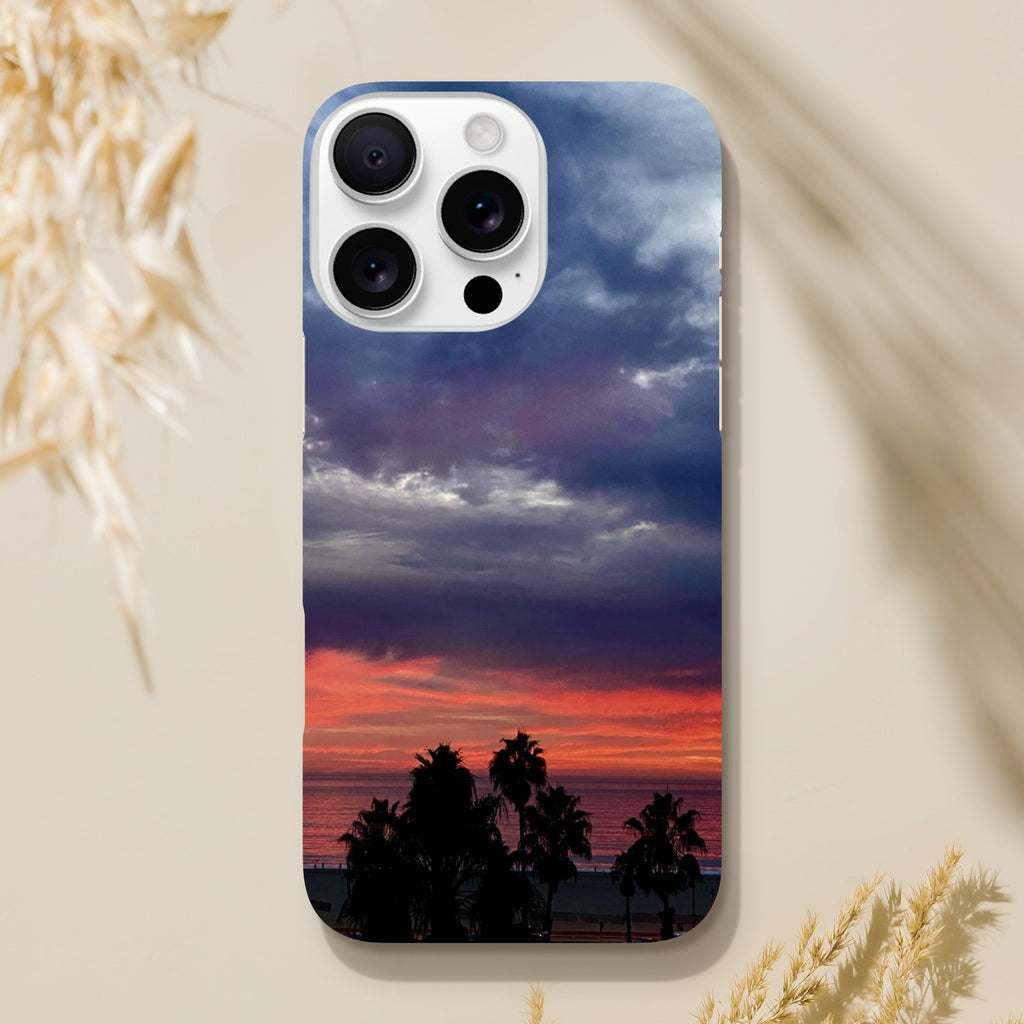Dramatic sunset print on iPhone Slim Case by My Store featuring Venice Beach design, perfect for beach lovers.