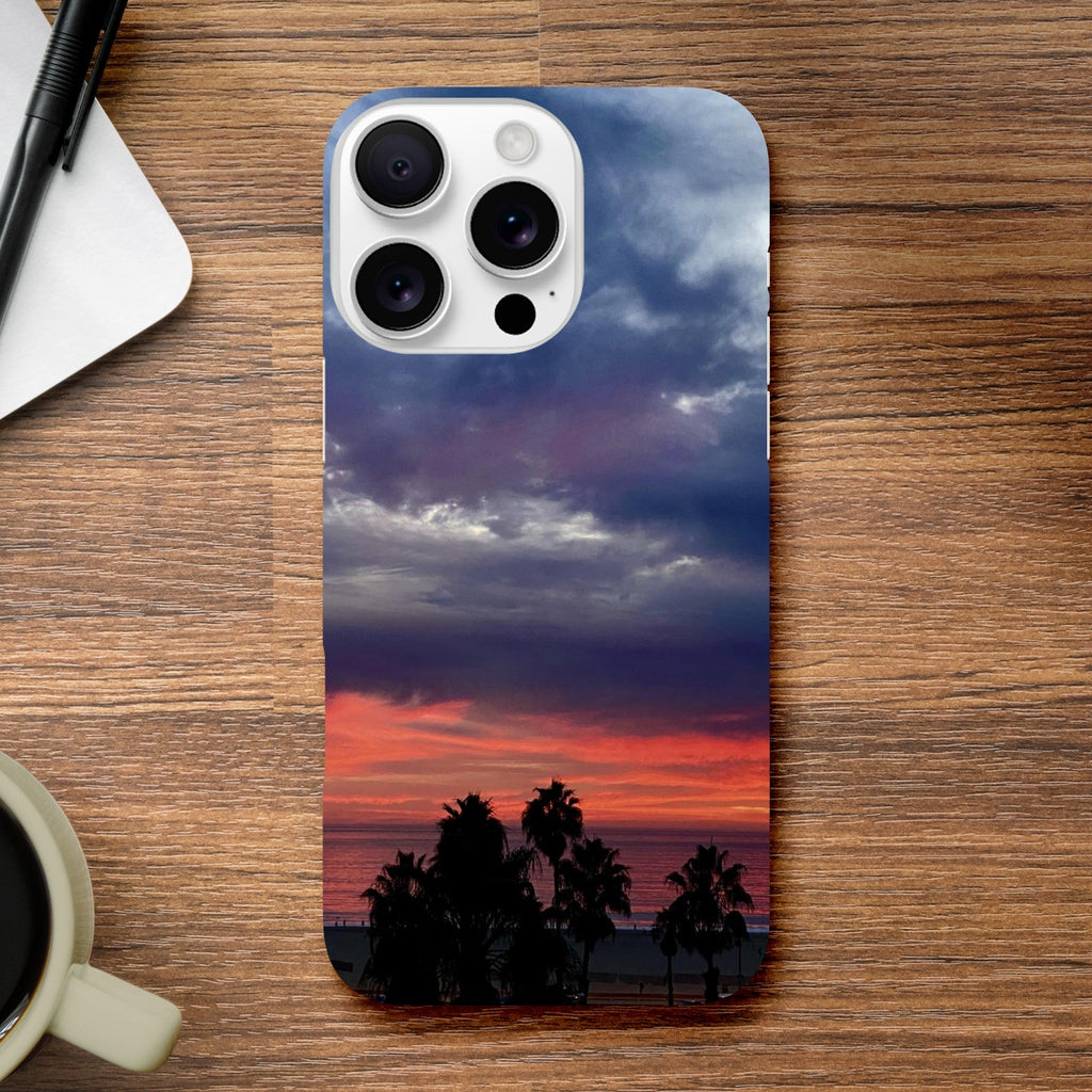 Slim iPhone 16 Pro Max case with dramatic sunset and Venice Beach design, featuring vibrant print material for beach lovers.