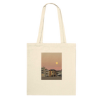 Eco-friendly cotton beach tote bag with colorful harvest full moon print, ideal for shopping and beach trips.