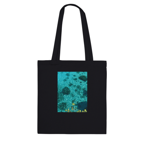 Eco-friendly cotton tote bag with long handles, featuring a chic Caribbean Magic print on natural-colored material.