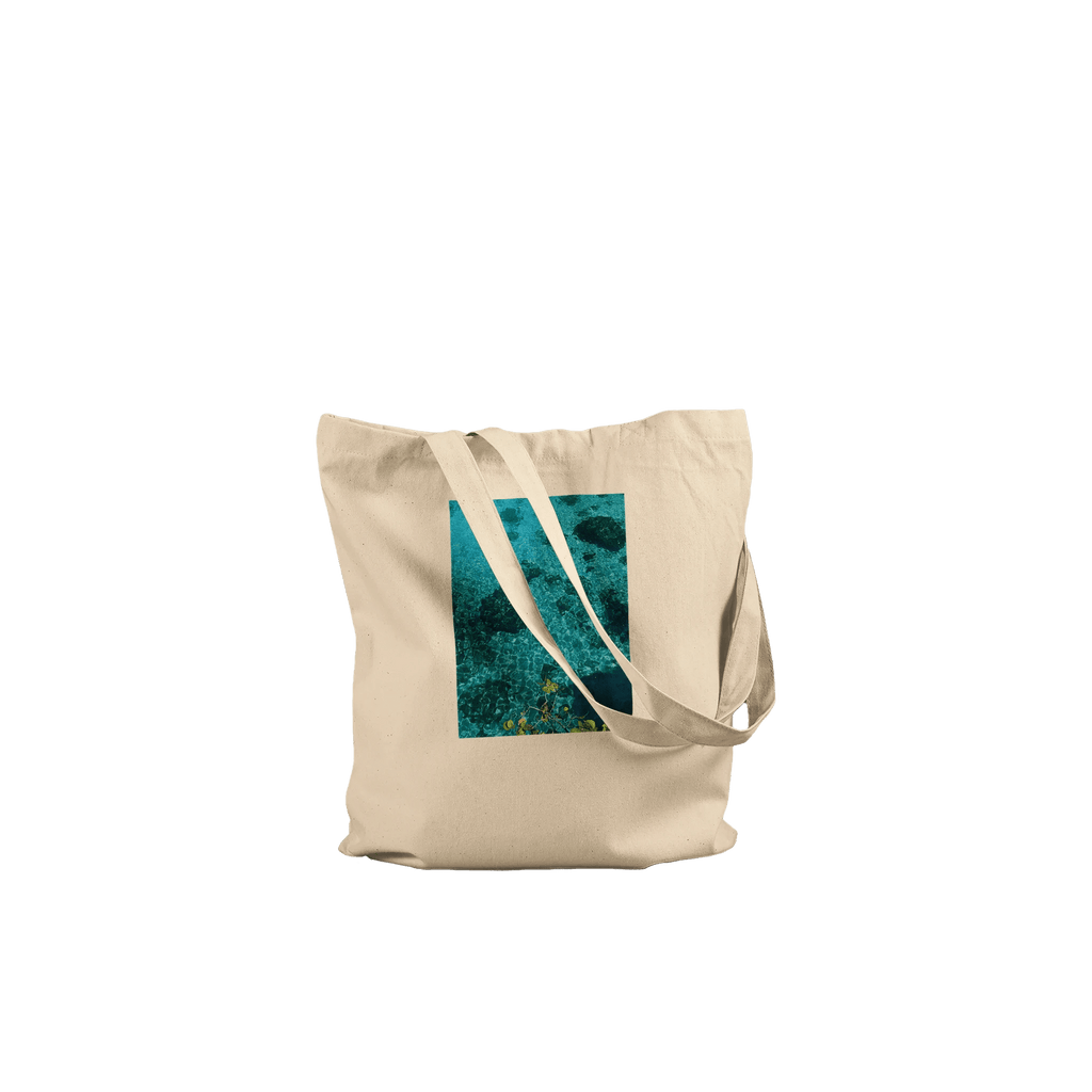 Eco-friendly cotton tote bag with long handles featuring a Chic Caribbean Magic print, perfect for casual carrying.