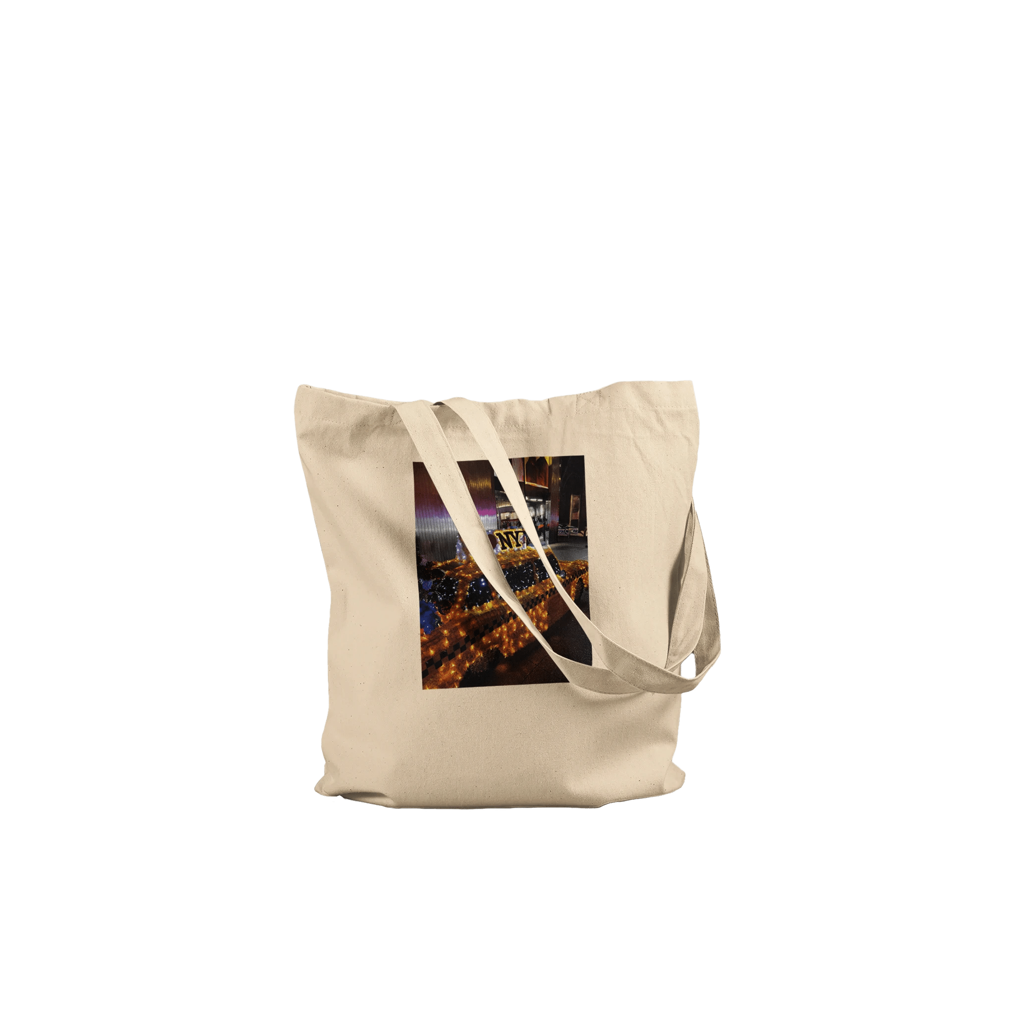 Eco-friendly cotton tote bag with NYC taxi cab holiday magic print, featuring vibrant cityscape design.