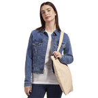 Eco-friendly cotton tote bag featuring a colorful NYC taxi cab holiday magic print, perfect for eco-conscious shoppers.