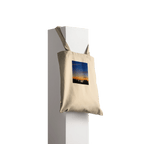 Eco-friendly California Sunset tote bag made of 100% cotton with vibrant sunset print, natural design showcasing colorful sky and silhouette.