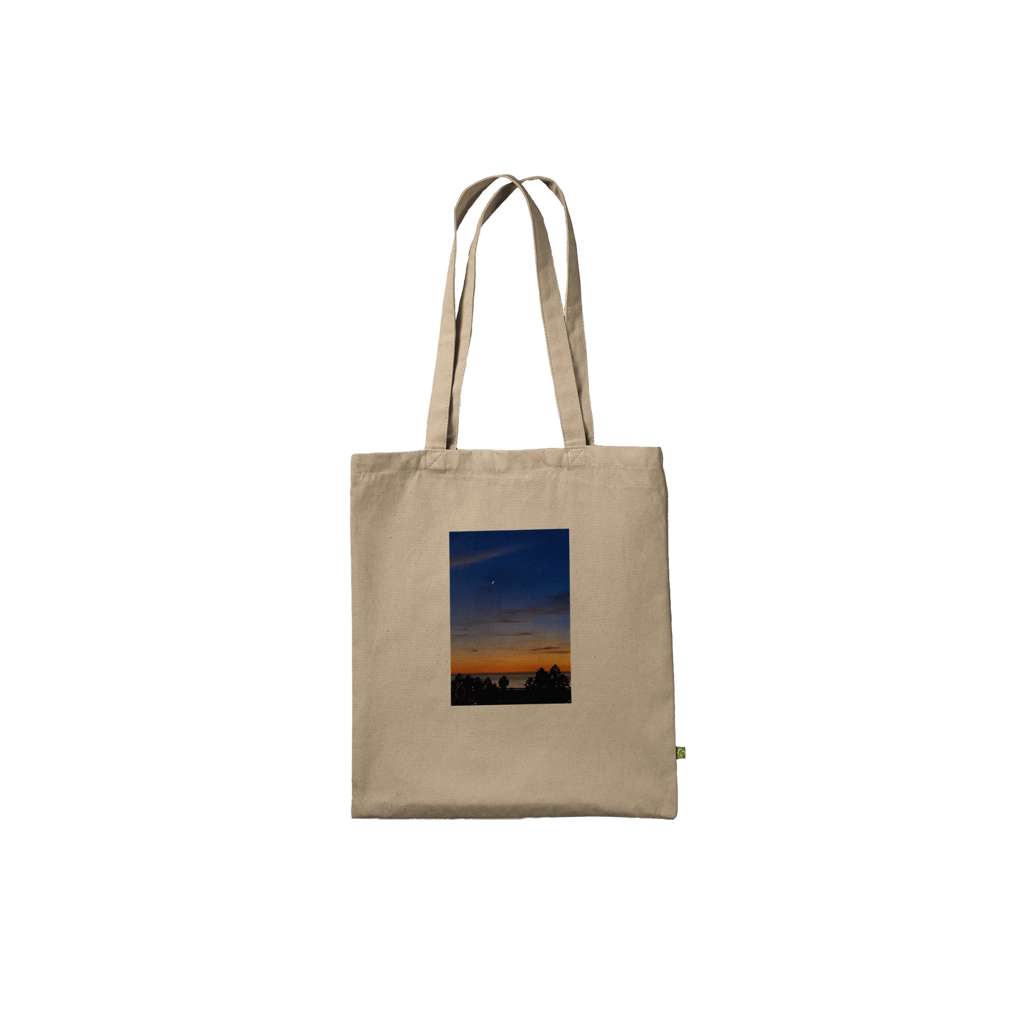 Eco-friendly California Sunset tote bag with vibrant print design made from 100% cotton, showcasing a stunning sunset scene.