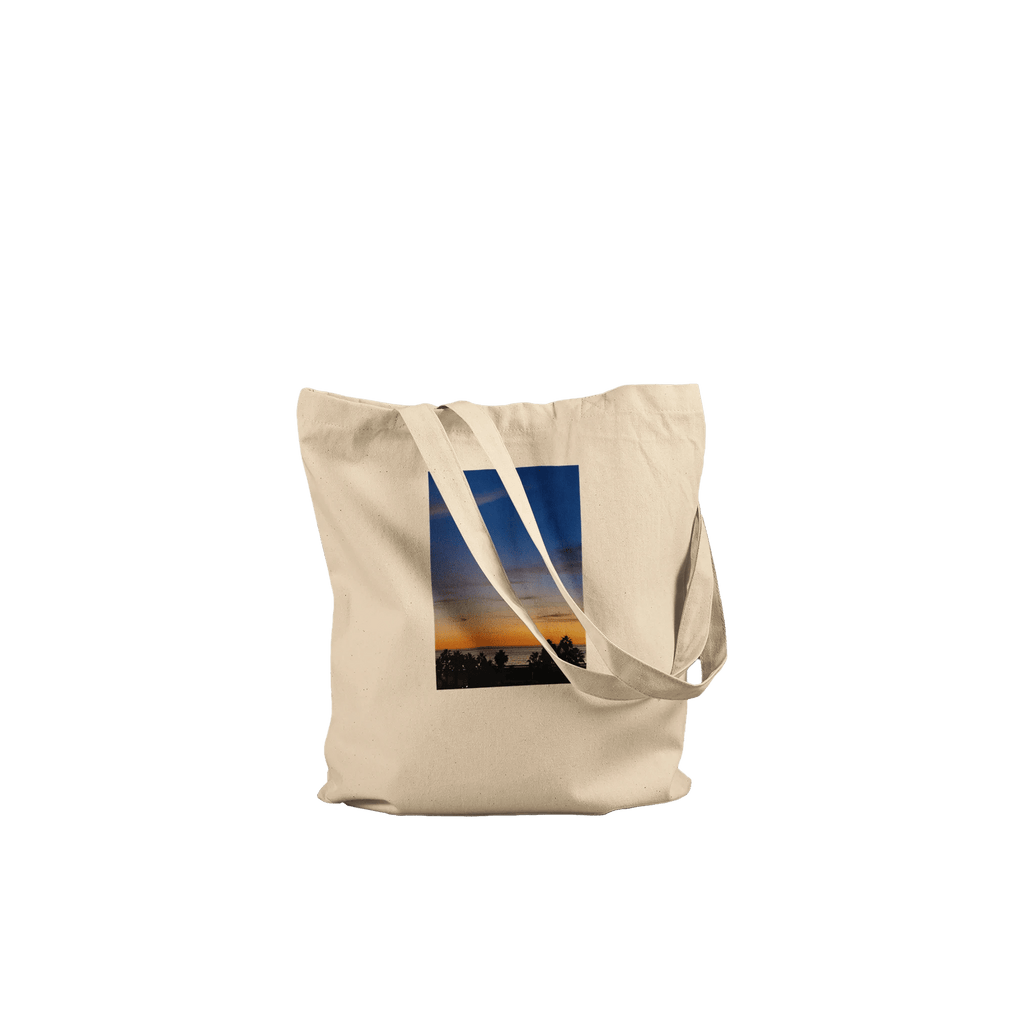 Eco-friendly California Sunset tote bag with vibrant sunset print, made from 100% cotton, showcasing natural, colorful design.