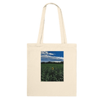 Stylish sunflower field print on eco-friendly tote bag made of premium material, featuring natural floral design.