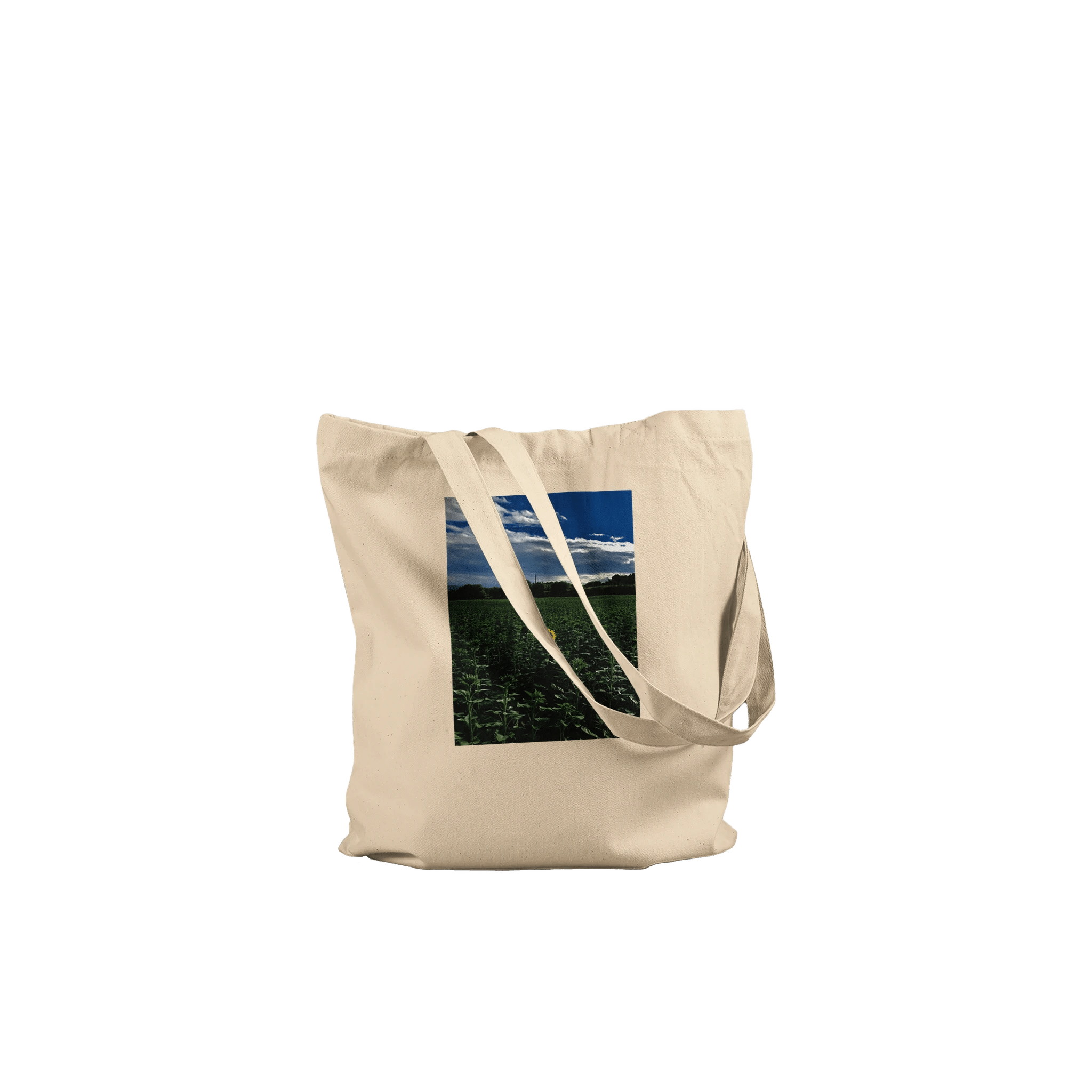 Stylish sunflower field print on eco-friendly tote bag made from premium natural material, designed for chic, eco-conscious fashion.